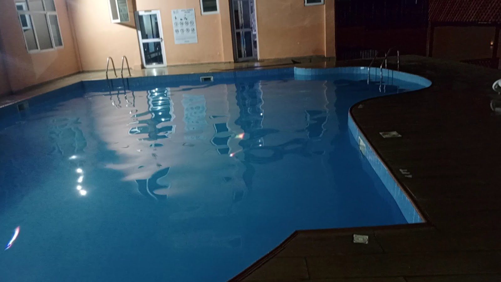 Courtyard pool illuminated in the evening
